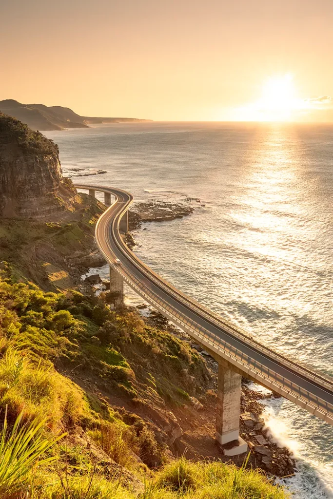 Coastal infrastructure photographed during golden hour overlooking the ocean.